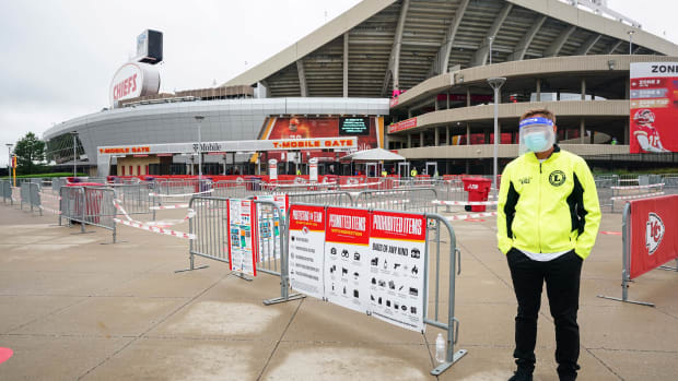 Sep 10, 2020; Kansas City, Missouri, USA; A member of security waits or fans to enter the stadium before the game between the Houston Texans and the Kansas City Chiefs at Arrowhead Stadium. Mandatory Credit: Jay Biggerstaff-USA TODAY Sports